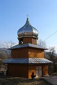 Two-story wooden bell tower from the 18th century in the village of Mshanets.