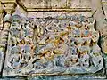 Panels show Ramayana and Mahabharata scenes, but much has been mutilated and defaced