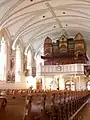 The Farrand & Votey organ is a 3-manual and pedal pipe organ that was installed at St. Martin of Tours Church in 1894, with the console being rebuilt in the style of the original by the Miller Pipe Organ Co.