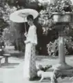 Empress Consort Wanrong in the Zhang Garden with her dog