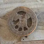 Seated figure with hawk