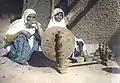 Two women with Charkha