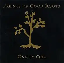 A gold foil tree debossed on a black background with foil spelling out the artist and album name