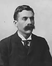 Young man with moustache in victorian suit