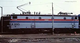 Silver locomotive with red and blue stripes