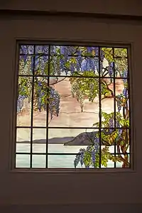 View of Oyster Bay (1908), by Louis Tiffany; named for Tiffany's locale, the piece actually evokes wisteria of the estate. Commissioned by William Skinner, and overseen by Belle, it was for the family's townhouse at 36 E. 38th Street, New York City. Today on display at The Met.