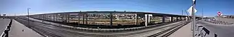 January 2019 view of another segment, from the Porfirio Diaz Street–Interstate 10 interchange ramp. The border fence, Rio Grande, and Ciudad Juarez are visible under the new elevated roadway.