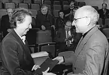 black-and-white image of Manfred Wekwerth on right, with Ruth Berghaus on left