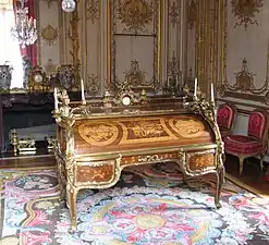 Bureau du Roi (Rococo); by Jean-François Oeben and Jean Henri Riesener; 1760–1769; bronze, marquetry of a variety of fine woods and Sèvres porcelain; 147.3 x 192.5 x 105; Palace of Versailles (Versailles, France)