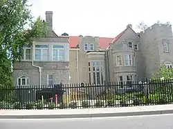 Large gated stone mansion