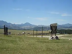 Mountains and grasslands surrounding a work center.