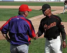 Felipe Alou (right), shown with the San Francisco Giants, managed ten seasons with the Expos.