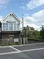Finningley Signal Box between Lincoln and Doncaster. Note remains of closed station in background.