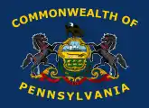 2007–2010 proposal, adding the words "Commonwealth Of" to the top and "Pennsylvania" to the bottom of the flag in yellow silk, and arching the lettering around the coat of arms