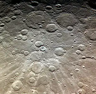 Exaggerated color image by MESSENGER with Van Gogh above center