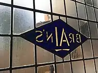 A Brains Brewery logo in stained glass