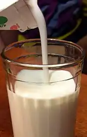 Plain milk kefir being poured