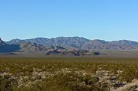 Valley's center-south, from east side.(North end of Highland Range (from east-southeast), McCullough Range massif beyond.)