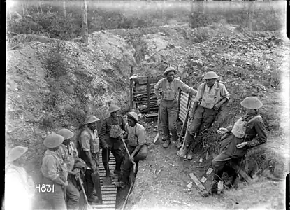 H831. A break from trench work near Gommecourt, France, 25 July 1918. Photo: Henry Armytage Sanders