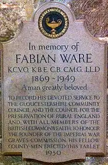 a plaque that reads "In memory of FabianWareKCVO, KBE, CB, CMG, LLD1869–1949 A man greatly belovedTo record his devoted service to the Gloucestershire community council and the council for the preservation of rural England and, with all the members of the British Commonwealth, to honour the founder of the Imperial War Graves Commission, his fellow county-men erected this tablet1950