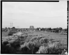 Overall view of Manzanola Bridge, State Highway 202 and Arkansas River, looking southwest