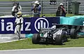 Pastor Maldonado exiting car after his crash during Malaysian Grand Prix practice session, 8 April 2011