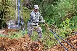 National Guard clearing trees from PR-184 after Hurricane Maria in 2017