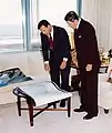 Christopher Cox shows President Ronald Reagan the blueprints for the new Federal Courthouse in 1993
