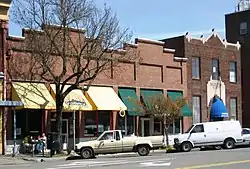 Photograph of two downtown buildings sharing a wall