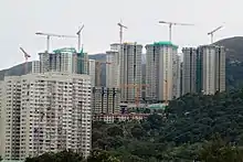  Tower blocks under construction on a forested hill