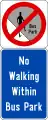 No jaywalking in the bus park