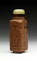 Chinese snuff bottle (biyanhu) with body from a moulded gourd, and a jade stopper