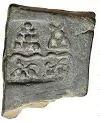 Taxila single-dye coin. Pile of stones, hill, river and unknown symbols (220-185 BCE).