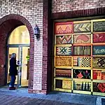 Bricked exterior facade of the main entrance to the Textile Museum of Canada