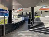 Footbridge users are redirected into the mall