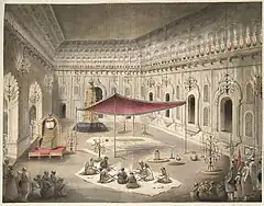 Funeral of Asaf-ud-Daulah in the year 1797 under a canopy inside the Bara Imambara; (note:Flag (green) of the Mughal Empire raised higher than the Awadh flag)