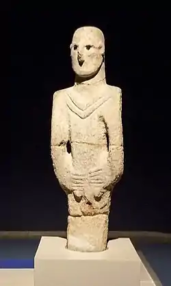 Urfa Man, in the Şanlıurfa Museum; sandstone, 1.80 meters, c. 9,000 BCE
