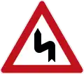 Sign 105-10Double curve (first left)