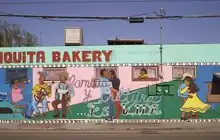 San Anto Cultural Arts' mural "Familia y Cultura es Vida" on an exterior wall of the Chiquita Bakery in the Mission District of San Antonio, Texas